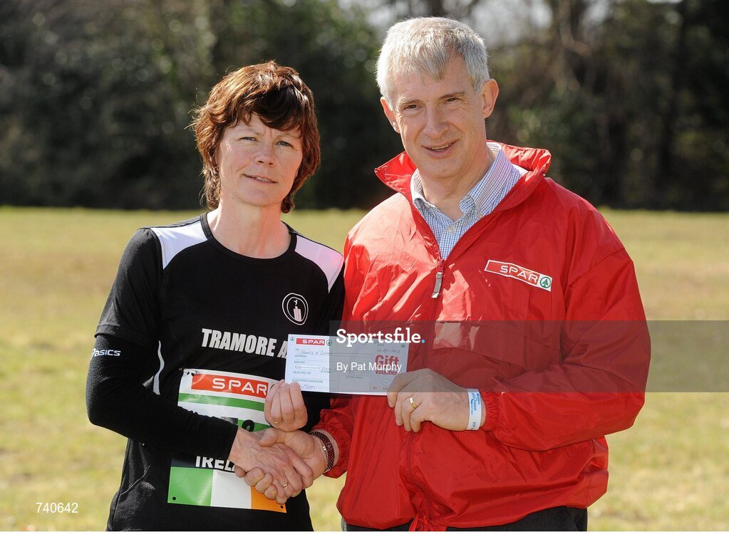 14 April 2013; Frances O'Connor, from Tramore, Co. Waterford, is presented with a SPAR voucher by Willie O'Byrne, Managing Director of SPAR Ireland, for competing in the SPAR Great Ireland Run 2013 on her 50th birthday. Phoenix Park, Dublin. Picture credit: Pat Murphy / SPORTSFILE