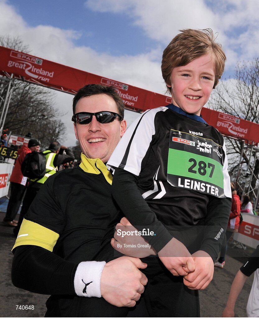 14 April 2013; James Russell, aged eight, from Ardee, Co. Louth, with his Uncle David McMahon after winning the 4 - 8 year old SPAR Mini Run 2013. Phoenix Park, Dublin. Picture credit: Tomás Greally / SPORTSFILE