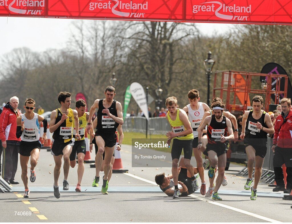14 April 2013; A general view of the start of the Elite Mens Mile event, where eventual winner, Paul Robinson, St. Coca's A.C., takes a fall. The SPAR Great Ireland Run 2013. Phoenix Park, Dublin. Picture credit: Tomás Greally / SPORTSFILE