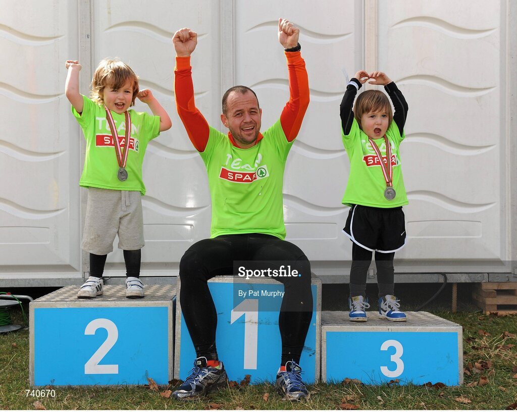 14 April 2013; SPAR team member Gerard O'Brien, from Malahide, Dublin, with his son Ross O'Brien, aged 4, left, and Levi Stafford, aged 3, from Malahide, after the SPAR Great Ireland Run 2013. Phoenix Park, Dublin. Picture credit: Pat Murphy / SPORTSFILE