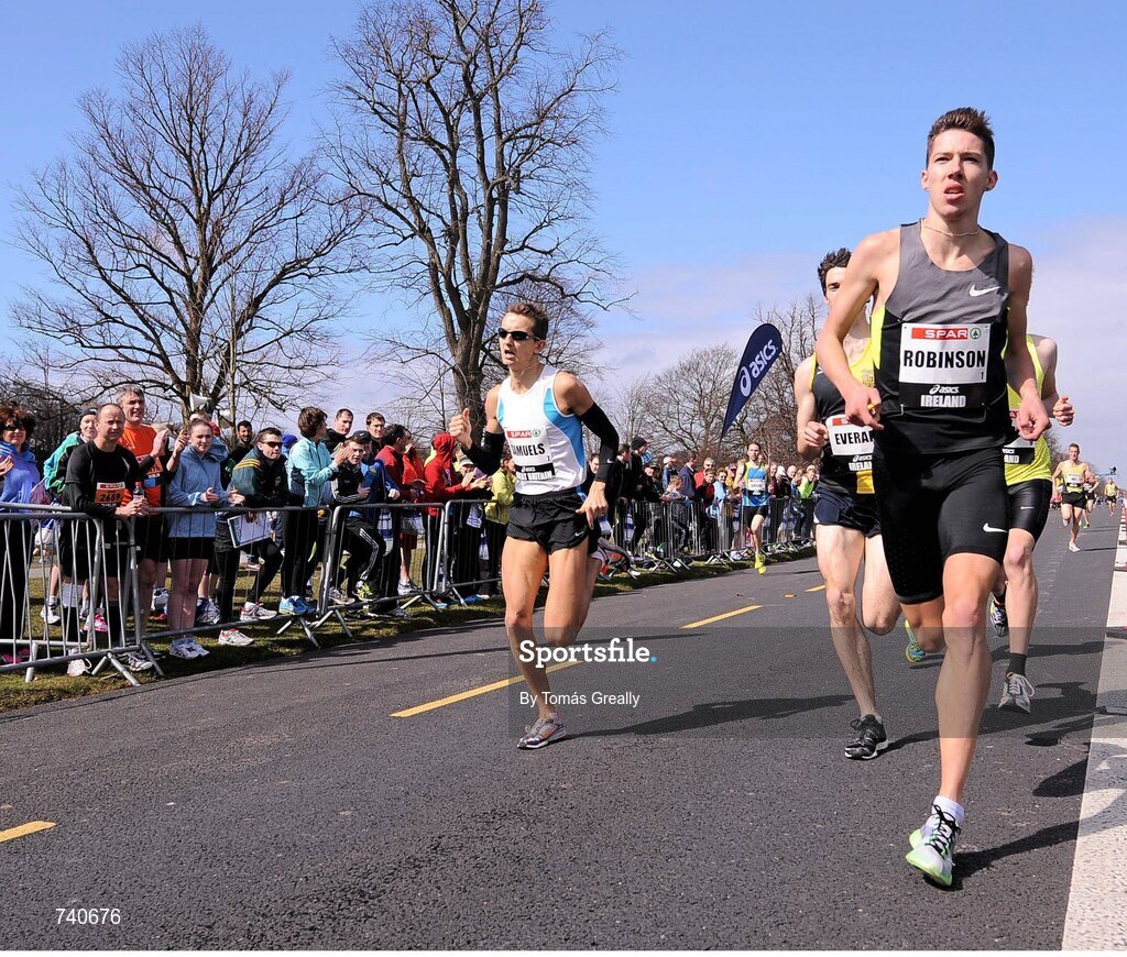14 April 2013; Paul Robinson, right, St. Coca's A.C, on his way to winning the Elite Mens Mile event. SPAR Great Ireland Run 2013. Phoenix Park, Dublin. Picture credit: Tomás Greally / SPORTSFILE