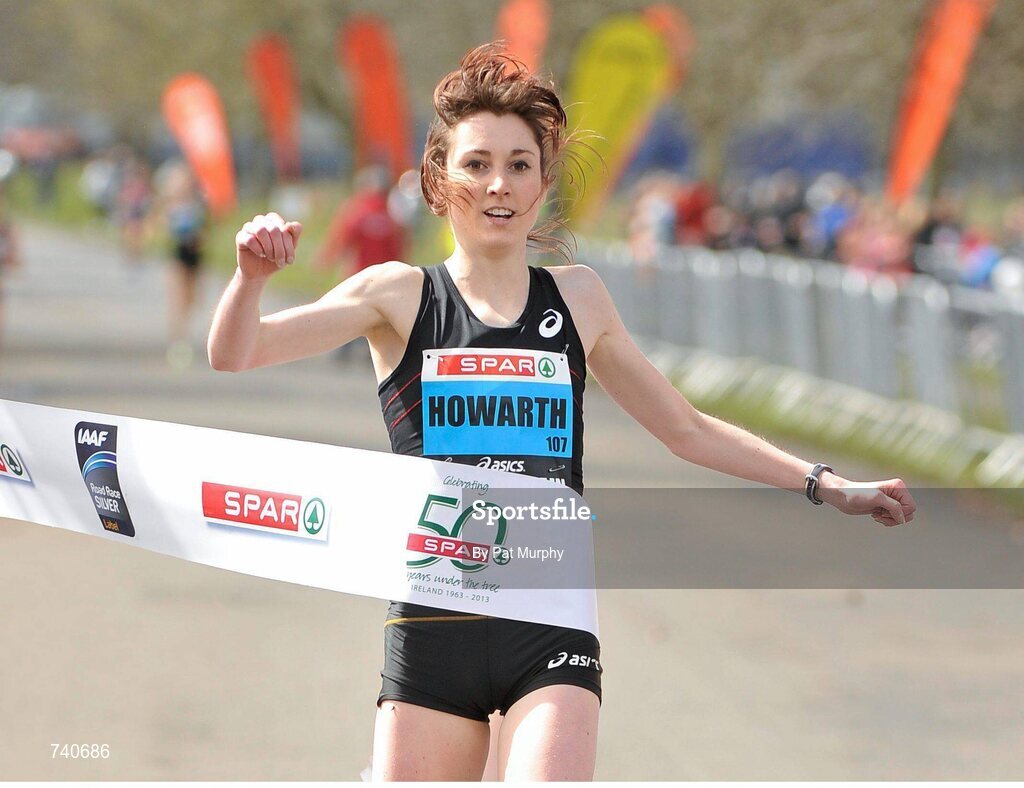 14 April 2013; Lauren Howarth, Great Britain, Leigh Harriers AC, crosses the finish line to win women's race at the SPAR Great Ireland Run 2013. Phoenix Park, Dublin. Picture credit: Pat Murphy / SPORTSFILE