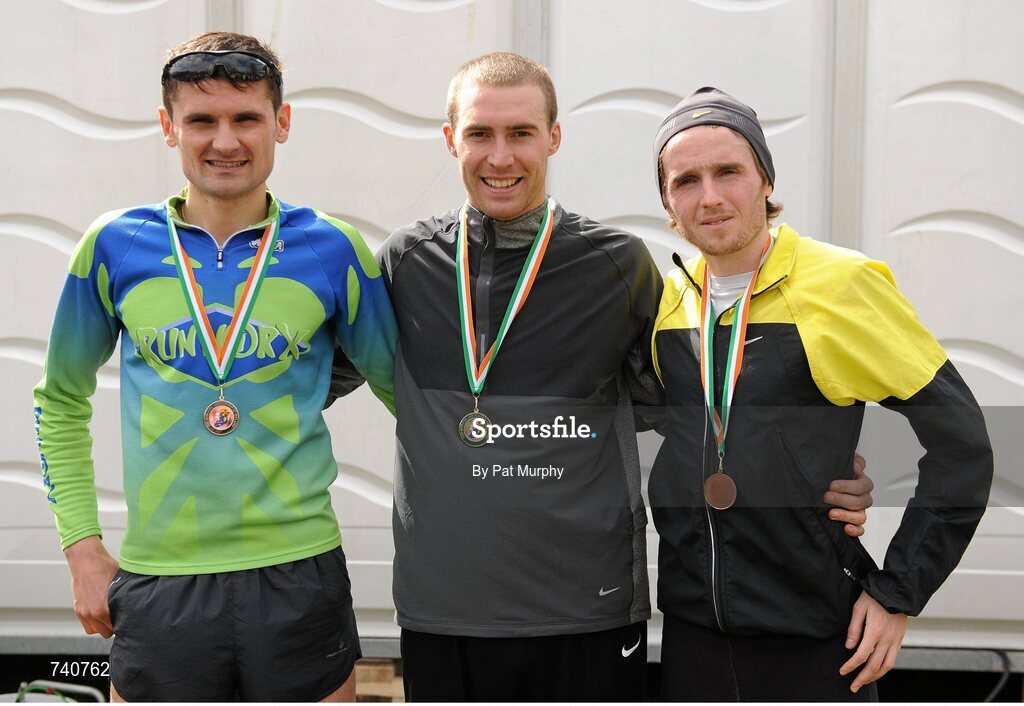 14 April 2013; Stephen Scullion, North Belfast Harriers, winner of the Irish National Championships at the SPAR Great Ireland Run 2013, with second placed Sergiu Cibanu, Clonliffe Harriers, left, and third placed Eddie McGinley, Annadale Striders, right. Phoenix Park, Dublin. Picture credit: Pat Murphy / SPORTSFILE
