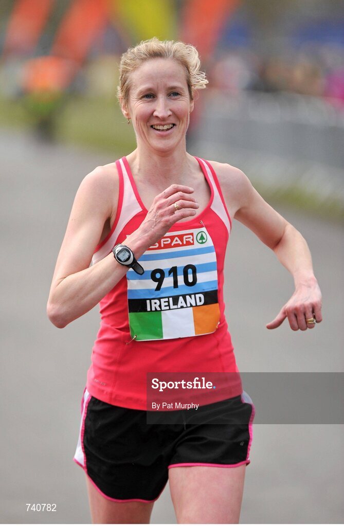 14 April 2013; Catherina McKiernan crosses the finish line during the Elite Women's event at the SPAR Great Ireland Run 2013. Phoenix Park, Dublin. Picture credit: Pat Murphy / SPORTSFILE