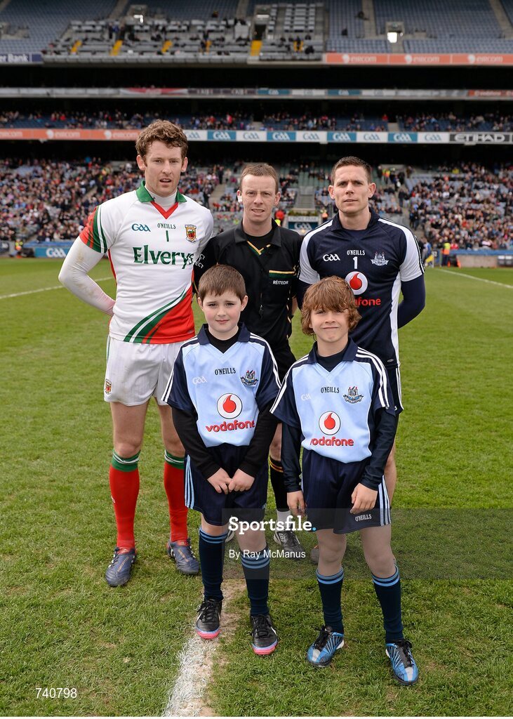 14 April 2013; Match day mascots Daniel Brodrick, front left, and Matthew Sherlock, front right, both from Raheny, Co. Dublin, with Mayo captain David Clark, left, referee Joe McQuillan and Dublin captain Stephen Cluxton, right. Allianz Football League, Division 1, Semi-Final, Dublin v Mayo, Croke Park, Dublin. Picture credit: Ray McManus / SPORTSFILE