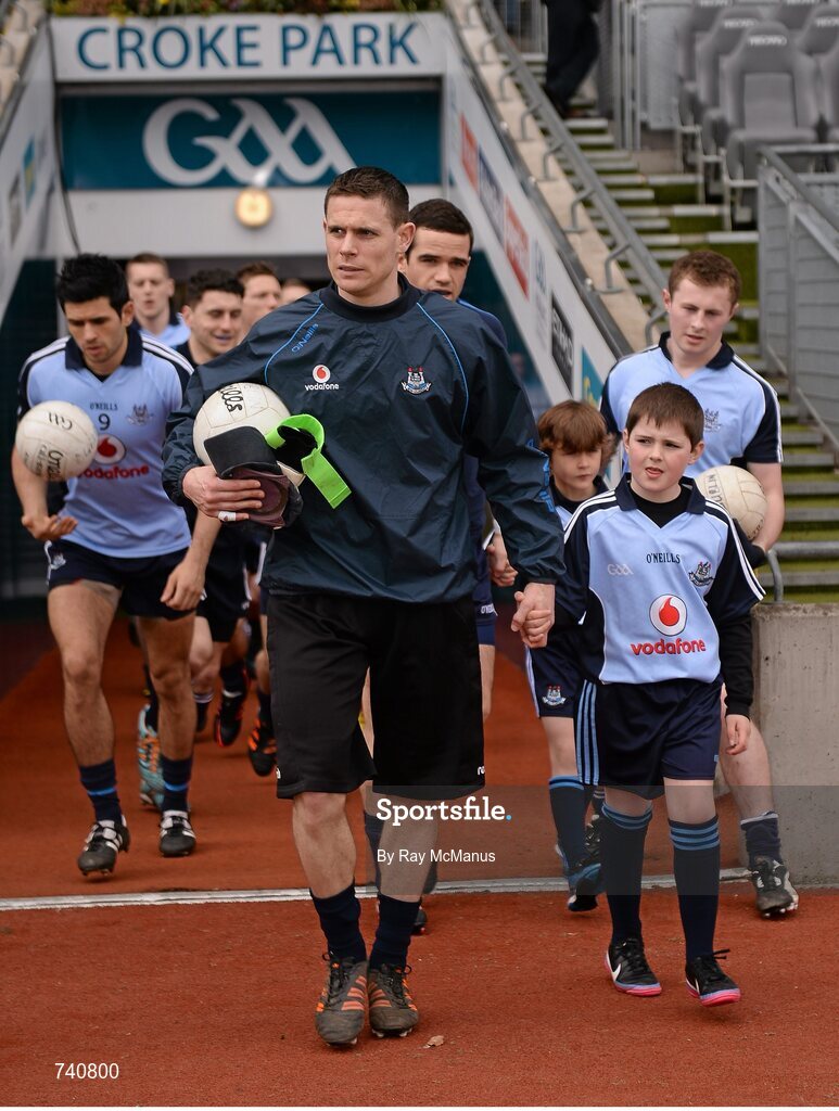 14 April 2013; Match day mascot Daniel Brodrick, Raheny, Co. Dublin, and Dublin captain Stephen Cluxton make their way on to the pitch for the game. Allianz Football League, Division 1, Semi-Final, Dublin v Mayo, Croke Park, Dublin. Picture credit: Ray McManus / SPORTSFILE