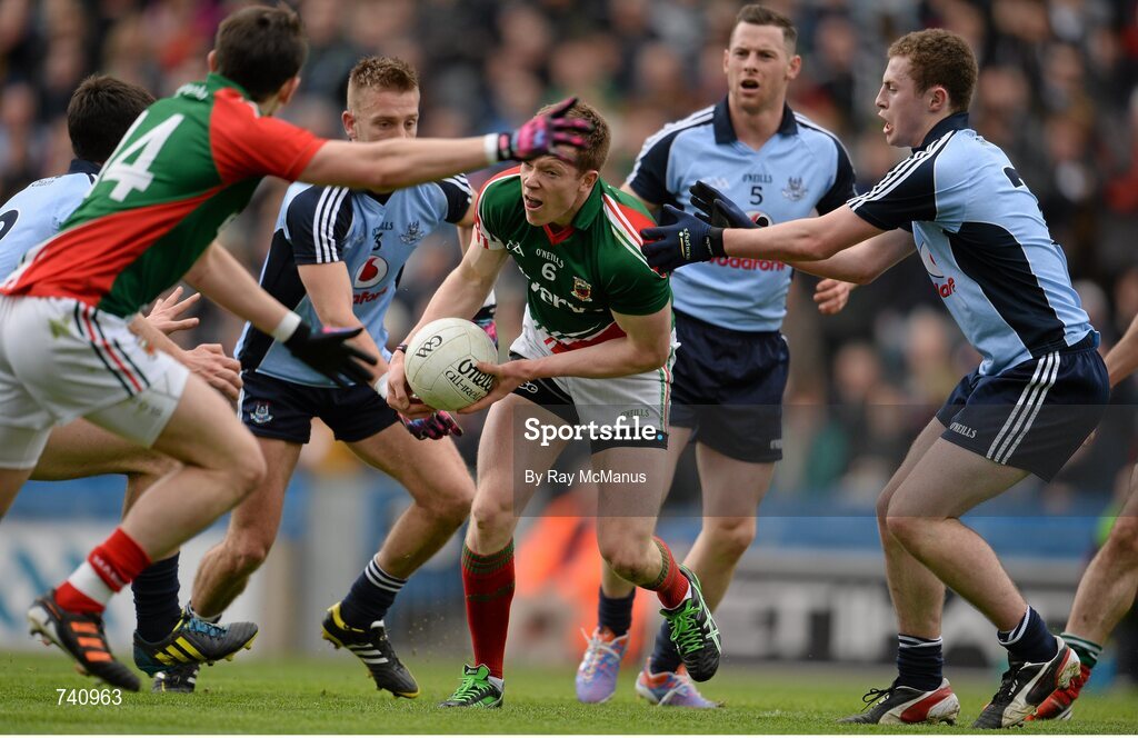14 April 2013; Donal Vaughan, Mayo, passes to team mate Jason Doherty as he is tackled by Jack McCaffrey, Dublin. Allianz Football League, Division 1, Semi-Final, Dublin v Mayo, Croke Park, Dublin. Picture credit: Ray McManus / SPORTSFILE