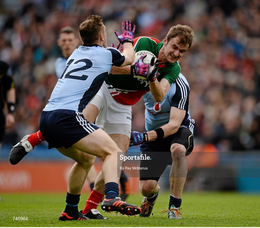 14 April 2013; Jason Gibbons, Mayo, is tackled by Dublin players Paul Flynn, 12, and Michael Darragh MacAuley. Allianz Football League, Division 1, Semi-Final, Dublin v Mayo, Croke Park, Dublin. Picture credit: Ray McManus / SPORTSFILE