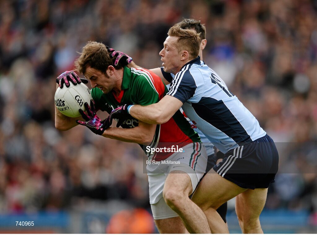 14 April 2013; Jason Gibbons, Mayo, is tackled by Dublin players Paul Flynn, 12, and Michael Darragh MacAuley. Allianz Football League, Division 1, Semi-Final, Dublin v Mayo, Croke Park, Dublin. Picture credit: Ray McManus / SPORTSFILE
