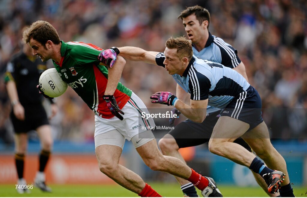 14 April 2013; Jason Gibbons, Mayo, is tackled by Dublin players Paul Flynn and Michael Darragh MacAuley. Allianz Football League, Division 1, Semi-Final, Dublin v Mayo, Croke Park, Dublin. Picture credit: Ray McManus / SPORTSFILE
