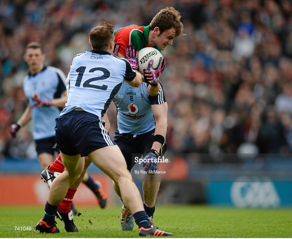 14 April 2013; Jason Gibbons, Mayo, is tackled by Dublin players Paul Flynn, 12, and Michael Darragh MacAuley. Allianz Football League, Division 1, Semi-Final, Dublin v Mayo, Croke Park, Dublin. Picture credit: Ray McManus / SPORTSFILE