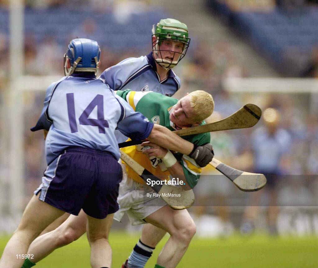 15 June 2003; Michael Cordial of Offaly in action against Kevin Flynn, 14, and Ronal Fallon of Dublin during the Guinness All Ireland Hurling Championship Qualifier Round 1 match between Dublin and Offaly at Croke Park in Dublin. Photo by Ray McManus/Sportsfile