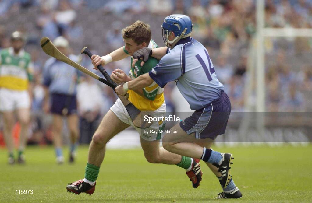 15 June 2003; Brian Carroll of Offaly in action against Kevin Flynn of Dublin during the Guinness All Ireland Hurling Championship Qualifier Round 1 match between Dublin and Offaly at Croke Park in Dublin. Photo by Ray McManus/Sportsfile