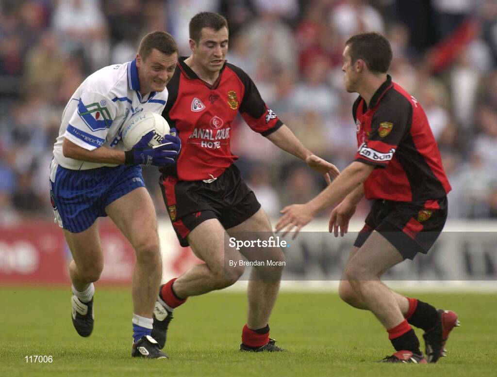 8 June 2003; James Coyle of Monaghan in action against Sean Ward and Brian Burns of Down during the Bank of Ireland Ulster Senior Football Championship Quarter-Final match between Down and Monaghan at Casement Park in Belfast. Photo by Brendan Moran/Sportsfile