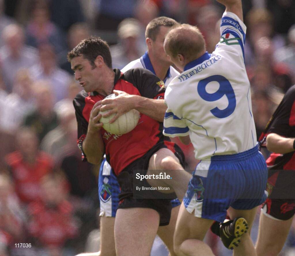 8 June 2003; Greg McCartan of Down in action against Jason Hughes of Monaghan during the Bank of Ireland Ulster Senior Football Championship Quarter-Final match between Down and Monaghan at Casement Park in Belfast. Photo by Brendan Moran/Sportsfile