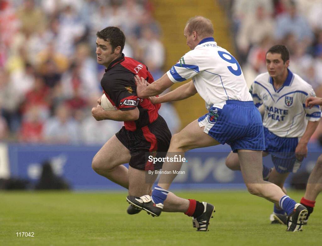 8 June 2003; Greg McCartan of Down in action against Jason Hughes of Monaghan during the Bank of Ireland Ulster Senior Football Championship Quarter-Final match between Down and Monaghan at Casement Park in Belfast. Photo by Brendan Moran/Sportsfile
