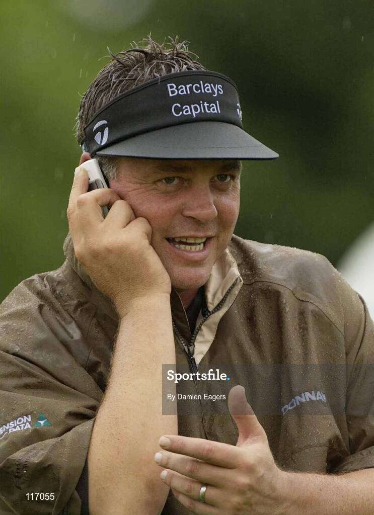 30 June 2003; Darren Clarke of Northern Ireland on the phone during a practice round in preparation for The Smurfit European Open at the K Club in Straffan, Kildare. Photo by Damien Eagers/Sportsfile