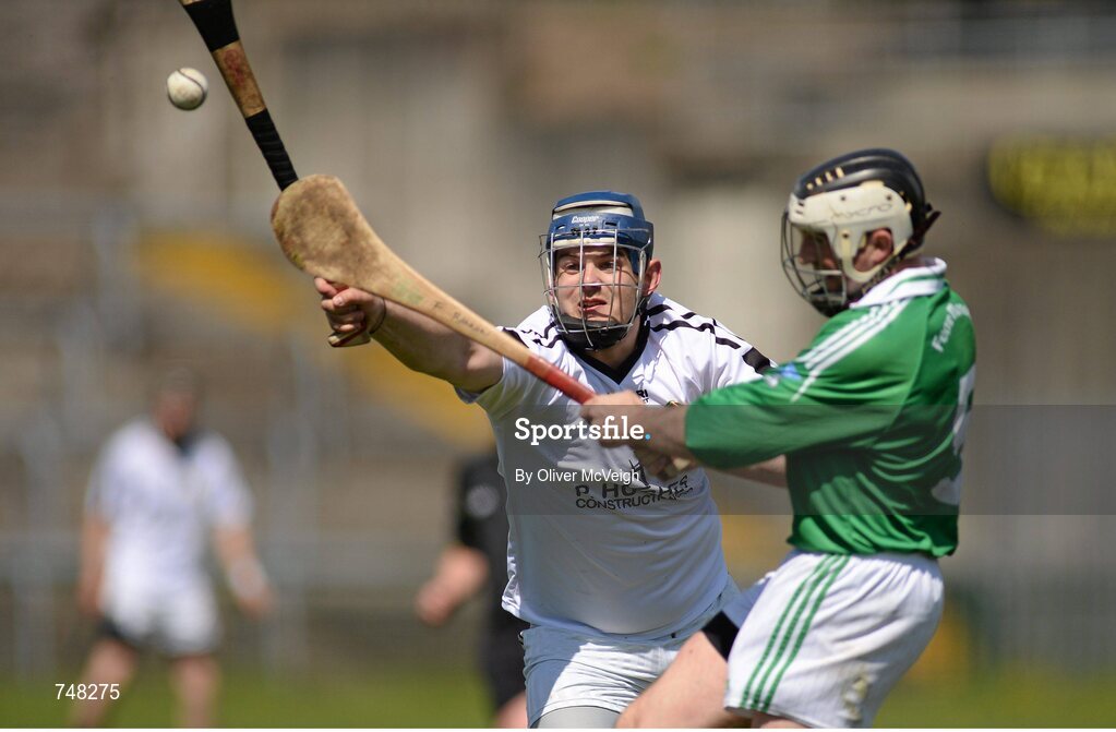 11 May 2013; Alan O'Neill, Warwickshire, attempts to block Fermanagh's Fergus Bannon. Lory Meagher Cup, Round 2, Fermanagh v Warwickshire, Brewster Park, Enniskillen, Co. Fermanagh. Picture credit: Oliver McVeigh / SPORTSFILE