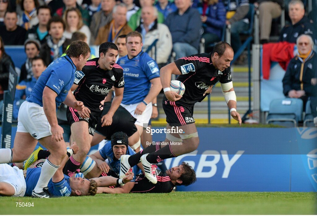 17 May 2013; Sergio Parisse, Stade Francais, is tripped by Leinster's Ian Madigan just short of the try-line. Amlin Challenge Cup Final 2012/13, Leinster v Stade Francais, RDS, Ballsbridge, Dublin. Picture credit: Brendan Moran / SPORTSFILE