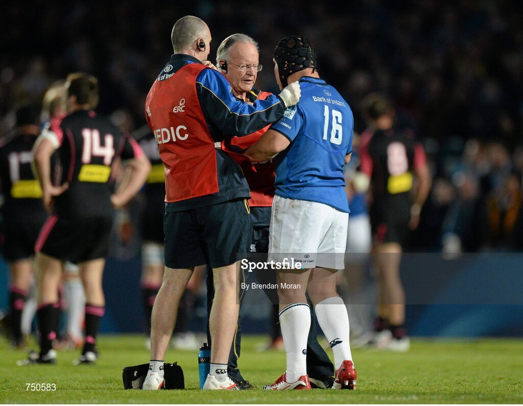 17 May 2013; Richardt Strauss, Leinster, is assessed by team doctor Professor Arthur Tanner, centre, and physio Garreth Farrell, before leaving the pitch in the second half. Amlin Challenge Cup Final 2012/13, Leinster v Stade Francais, RDS, Ballsbridge, Dublin. Picture credit: Brendan Moran / SPORTSFILE