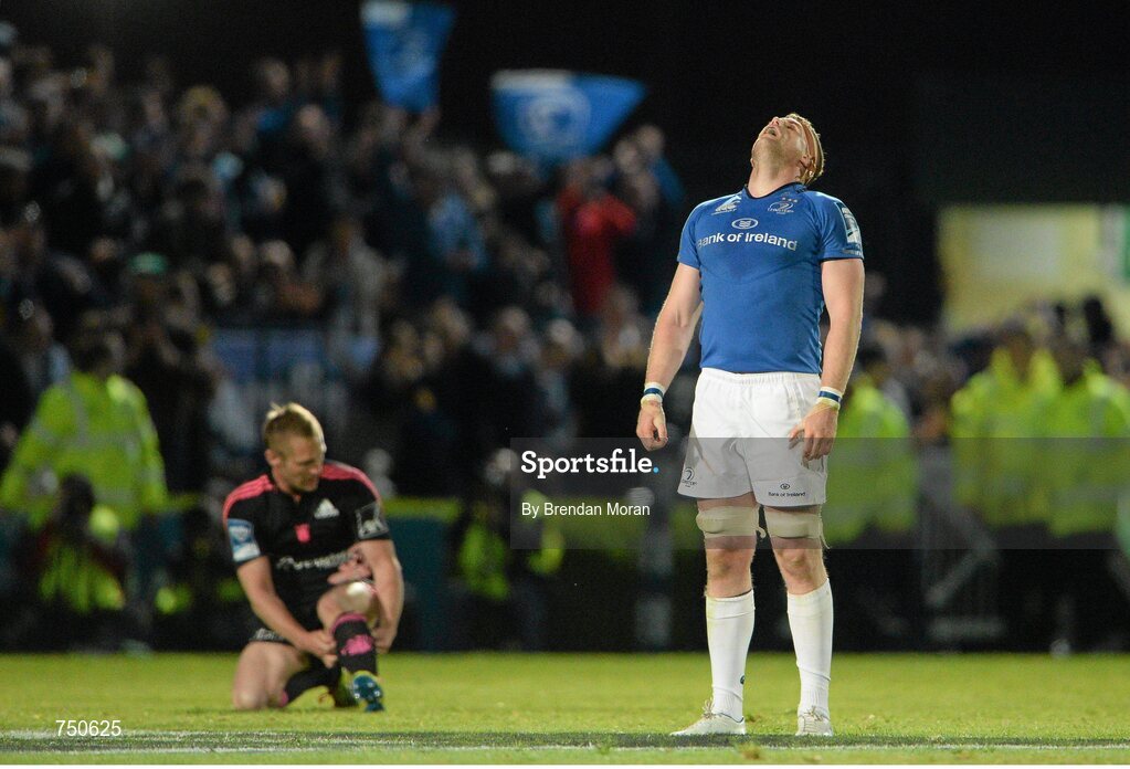 17 May 2013; Leinster's Jamie Heaslip celebrates at the final whistle, as Stade Francais' Paul Warwick looks on. Amlin Challenge Cup Final 2012/13, Leinster v Stade Francais, RDS, Ballsbridge, Dublin. Picture credit: Brendan Moran / SPORTSFILE