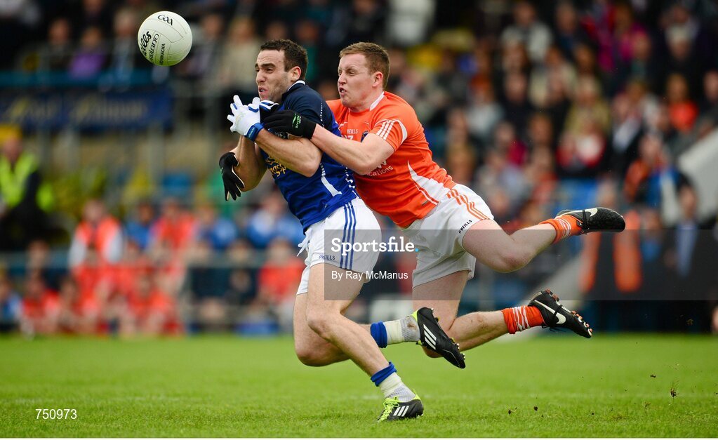 19 May 2013; Eugene Keating, Cavan, is tackled by Declan McKenna, Armagh. Ulster GAA Football Senior Championship, Preliminary Round, Cavan v Armagh, Kingspan Breffni Park, Cavan. Picture credit: Ray McManus / SPORTSFILE