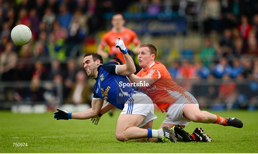 19 May 2013; Eugene Keating, Cavan, is tackled by Declan McKenna, Armagh. Ulster GAA Football Senior Championship, Preliminary Round, Cavan v Armagh, Kingspan Breffni Park, Cavan. Picture credit: Ray McManus / SPORTSFILE