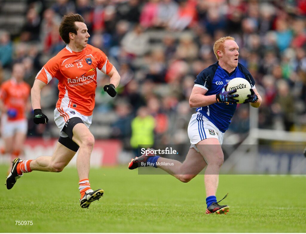 19 May 2013; Cian Mackey bursts past Armagh's Tony Kernan to score a Cavan goal in the 12th minute. Ulster GAA Football Senior Championship, Preliminary Round, Cavan v Armagh, Kingspan Breffni Park, Cavan. Picture credit: Ray McManus / SPORTSFILE