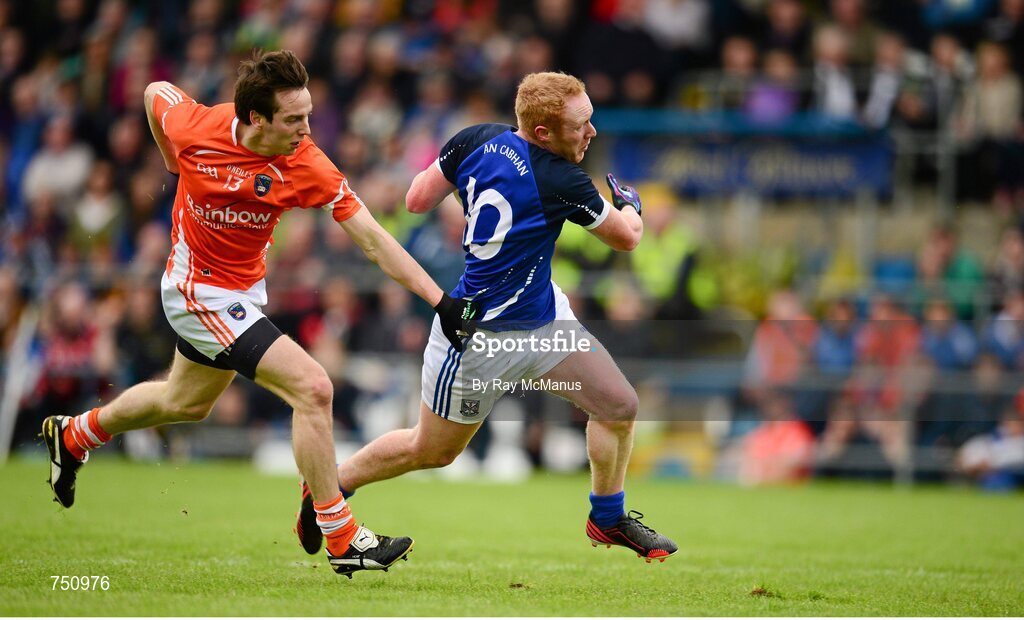 19 May 2013; Cian Mackey bursts past Armagh's Tony Kernan to score a Cavan goal in the 12th minute. Ulster GAA Football Senior Championship, Preliminary Round, Cavan v Armagh, Kingspan Breffni Park, Cavan. Picture credit: Ray McManus / SPORTSFILE