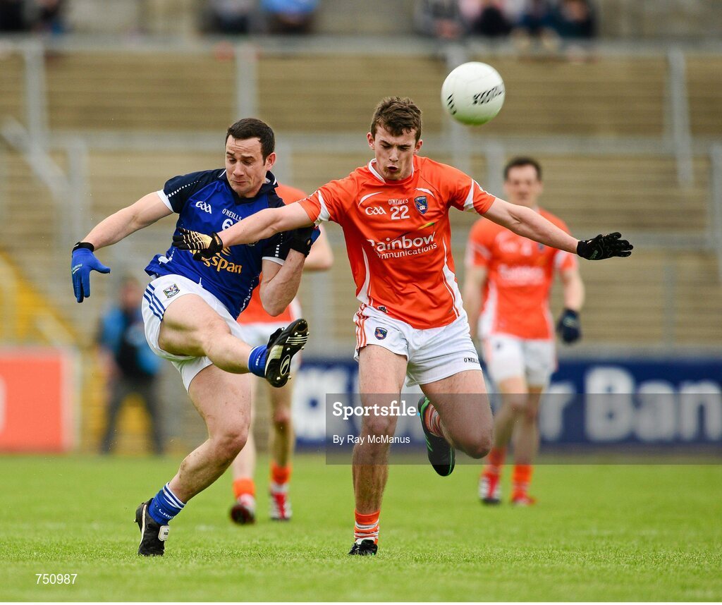 19 May 2013; Alan Clarke, the Cavan captain, in action against Ethan Rafferty, Armagh. Ulster GAA Football Senior Championship, Preliminary Round, Cavan v Armagh, Kingspan Breffni Park, Cavan. Picture credit: Ray McManus / SPORTSFILE