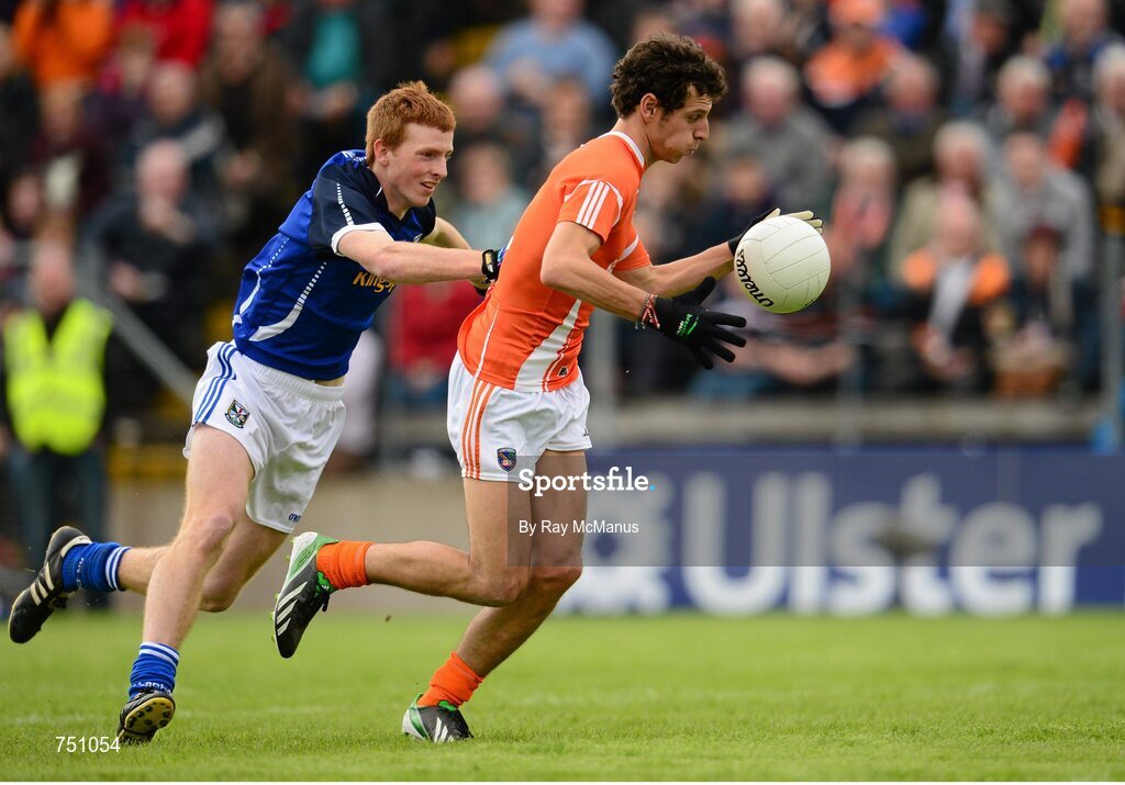 19 May 2013; Jamie Clarke, Armagh, has his jersey pulled by Cavan corner back Jason McLoughlin as he bursts through to score a goal for Armagh, which was subsequently disallowed in favour of a free. Ulster GAA Football Senior Championship, Preliminary Round, Cavan v Armagh, Kingspan Breffni Park, Cavan. Picture credit: Ray McManus / SPORTSFILE