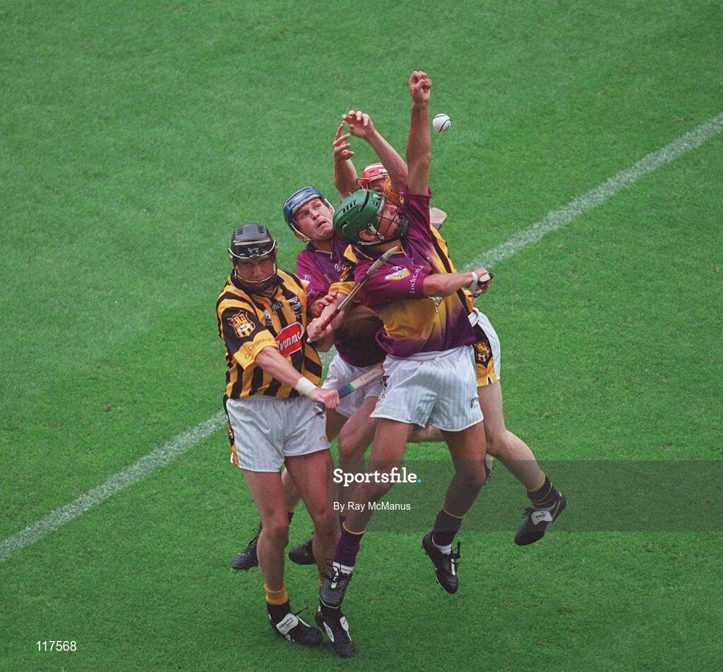 6 July 2003; Wexford pair Colm Kehoe (green helmet) and Keith Rossiter in action against Kilkenny's Eddie Brennan and Tommy Walsh, hidden. Guinness Leinster Senior Hurling Championship Final, Kilkenny v Wexford, Croke Park, Dublin. Picture credit; Ray McManus/ SPORTSFILE