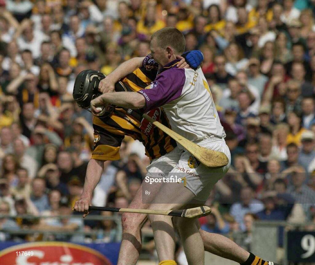 6 July 2003; Damien Fitzhenry, Wexford, in action against Kilkenny's Martin Comerford. Guinness Leinster Senior Hurling Championship Final, Kilkenny v Wexford, Croke Park, Dublin. Picture credit; Pat Murphy / SPORTSFILE *EDI*