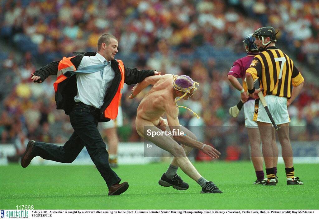 6 July 2003; A streaker is caught by a stewart after coming on to the pitch. Guinness Leinster Senior Hurling Championship Final, Kilkenny v Wexford, Croke Park, Dublin. Picture credit; Ray McManus / SPORTSFILE