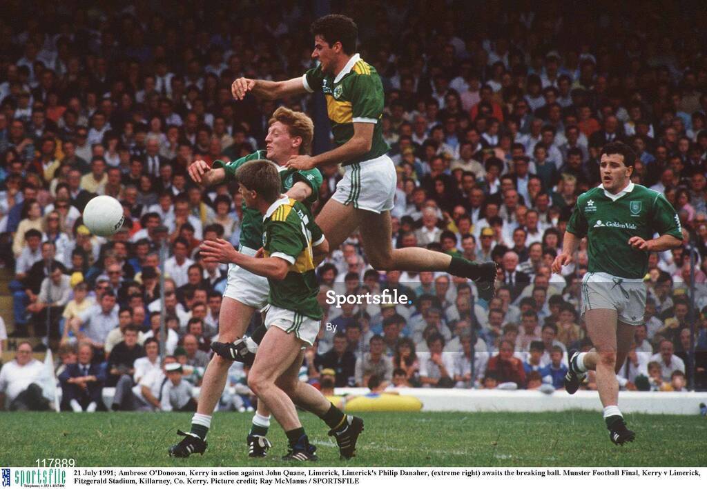 21 July 1991; Ambrose O'Donovan, Kerry in action against John Quane, Limerick, Limerick's Philip Danaher, (extreme right) awaits the breaking ball. Munster Football Final, Kerry v Limerick, Fitzgerald Stadium, Killarney, Co. Kerry. Picture credit; Ray McManus / SPORTSFILE