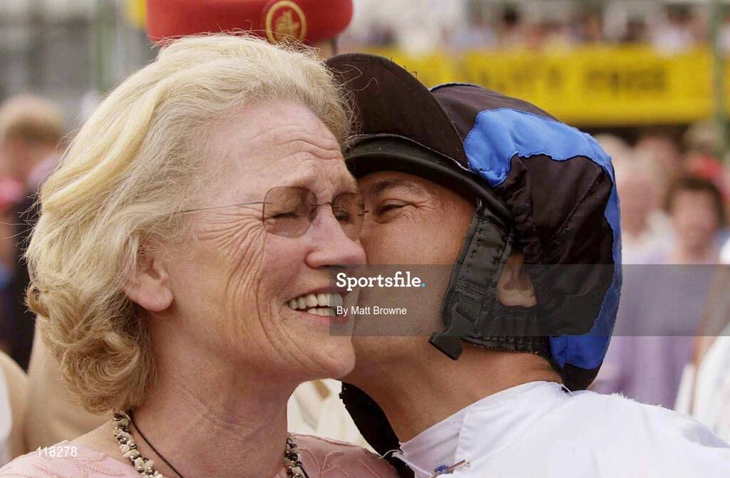 13 July 2003; Frankie Dettori kisses Maureen Mullins, wife of trainer Paddy Mullins, after winning the Darley Irish Oaks at the Curragh Racecourse, Co. Kildare. Picture credit; Matt Browne / SPORTSFILE *EDI*