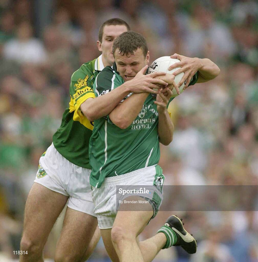13 July 2003; Limerick's Jason Stokes is tackled by Kerry's Eoin Brosnan which resulted in Limerick's first penalty. Bank of Ireland Munster Senior Football Final, Kerry v Limerick, Fitzgerald Stadium, Killarney, Co Kerry. Picture credit; Brendan Moran / SPORTSFILE *EDI*