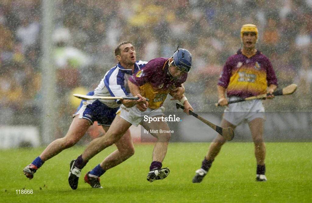 19 July 2003; Barry Lambert, Wexford, is tackled by Waterford's Tony Browne. Guinness Senior Hurling Championship qualifier, Wexford v Waterford, Nowlan Park, Kilkenny. Picture credit; Matt Browne / SPORTSFILE *EDI*