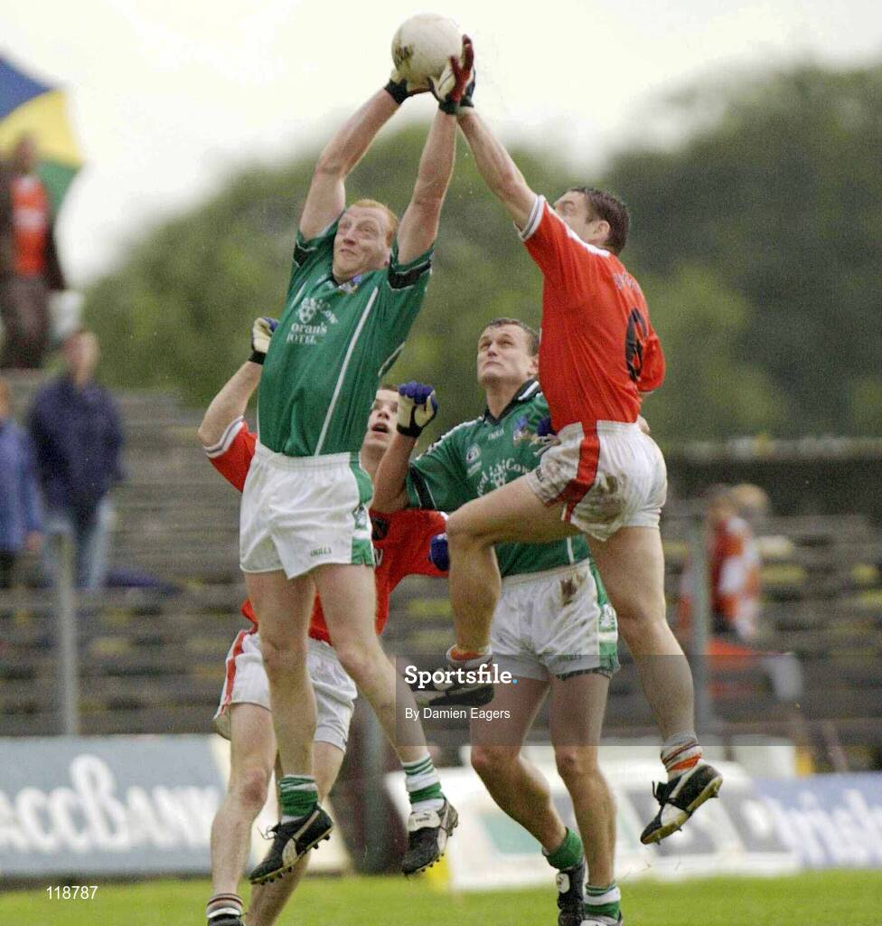 20 July 2003; John Quaine, Limerick, in action against Armagh's Kieran McGeeney. Bank of Ireland Senior Football Championship qualifier, Limerick v Armagh, Dr Hyde Park, Roscommon. Picture credit; Damien Eagers / SPORTSFILE *EDI*