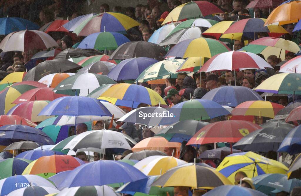 20 July 2003; Supporters pictured sheltering under their umbrellas at half time. Bank of Ireland Senior Football Championship qualifier, Limerick v Armagh, Dr Hyde Park, Roscommon. Picture credit; Damien Eagers / SPORTSFILE *EDI*