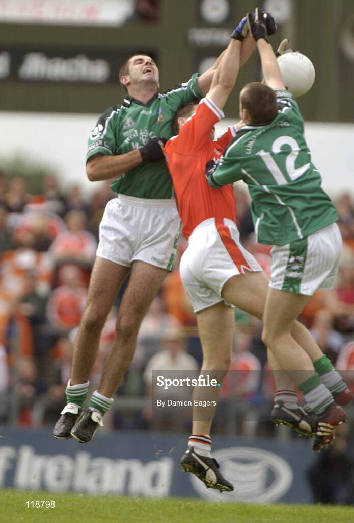 20 July 2003; Limerick's John Galvin and Stephen Lavin, (12), in action against Armagh's Paul McGrane. Bank of Ireland Senior Football Championship qualifier, Limerick v Armagh, Dr Hyde Park, Roscommon. Picture credit; Damien Eagers / SPORTSFILE *EDI*