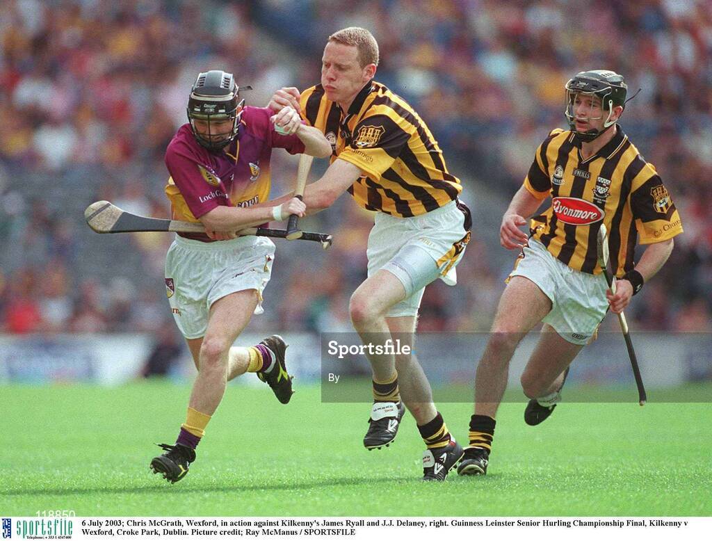 6 July 2003; Chris McGrath, Wexford, in action against Kilkenny's James Ryall and J.J. Delaney, right. Guinness Leinster Senior Hurling Championship Final, Kilkenny v Wexford, Croke Park, Dublin. Picture credit; Ray McManus / SPORTSFILE