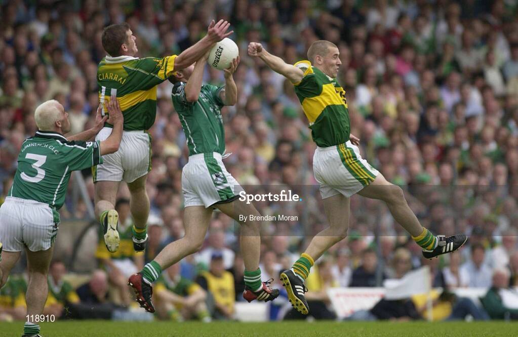 13 July 2003; Stephen Lavin, Limerick, assisted by team-mate Diarmuid Sheehy, fields a ball between Kerry's Dara O'Cinneide and Sean O'Sullivan. Bank of Ireland Munster Senior Football Final, Kerry v Limerick, Fitzgerald Stadium, Killarney, Co Kerry. Picture credit; Brendan Moran / SPORTSFILE *EDI*