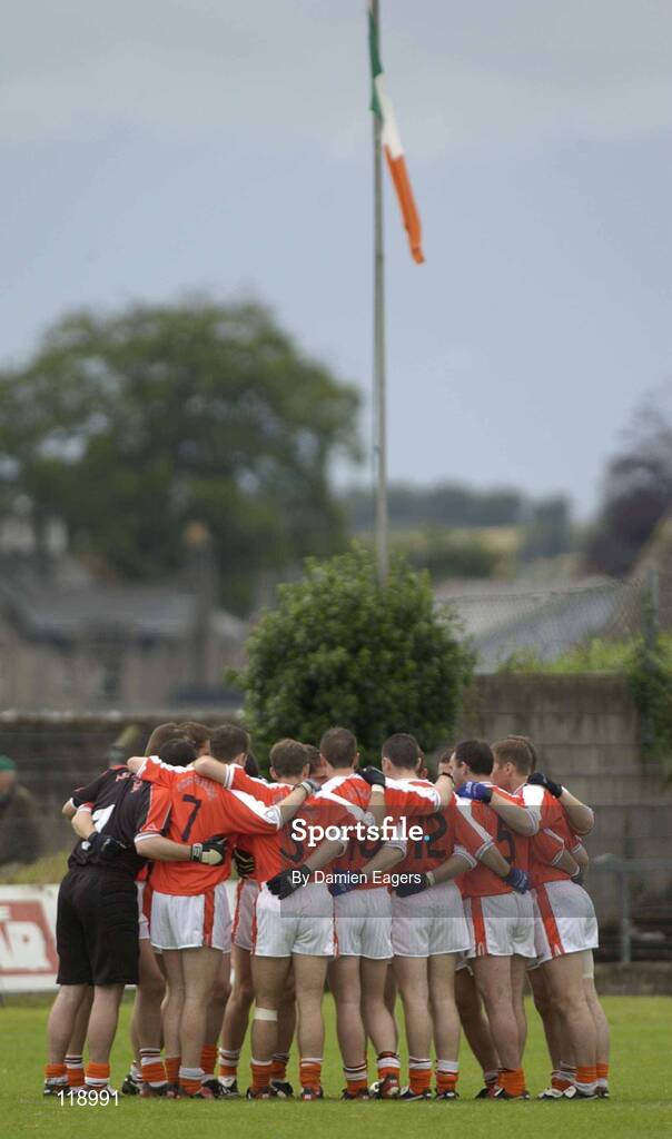 20 July 2003; The Armagh team pictured in a huddle with the Tricolour in the backround. Bank of Ireland Senior Football Championship qualifier, Limerick v Armagh, Dr Hyde Park, Roscommon. Picture credit; Damien Eagers / SPORTSFILE *EDI*