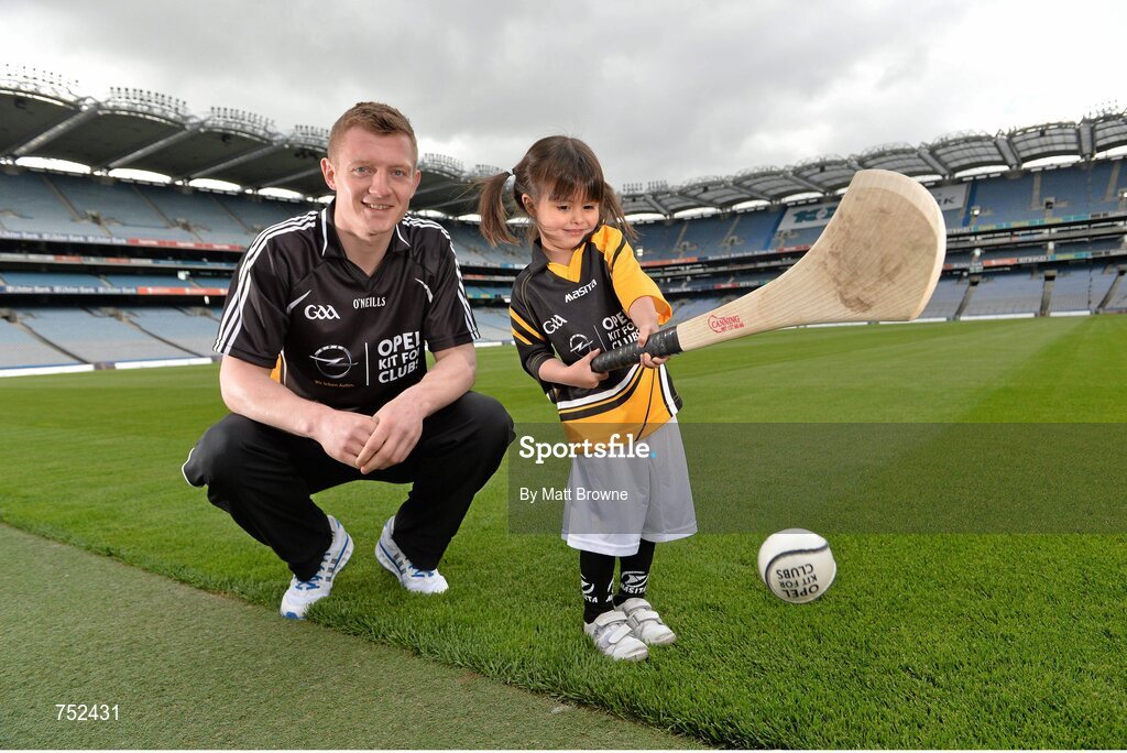 23 May 2013; Galway hurler Joe Canning with four year old Carolina Gallagher, from Swords, Co. Dublin, at the launch of Opel Kits for Clubs 2013 – For every test drive, car service or Opel purchase made through the Opel dealer network, your local GAA club is awarded points. Build up your points and redeem them against high quality kit for your club! Log onto opelkitforclubs.com and start earning points today. Support your local GAA club! Croke Park, Dublin. Picture credit: Matt Browne / SPORTSFILE