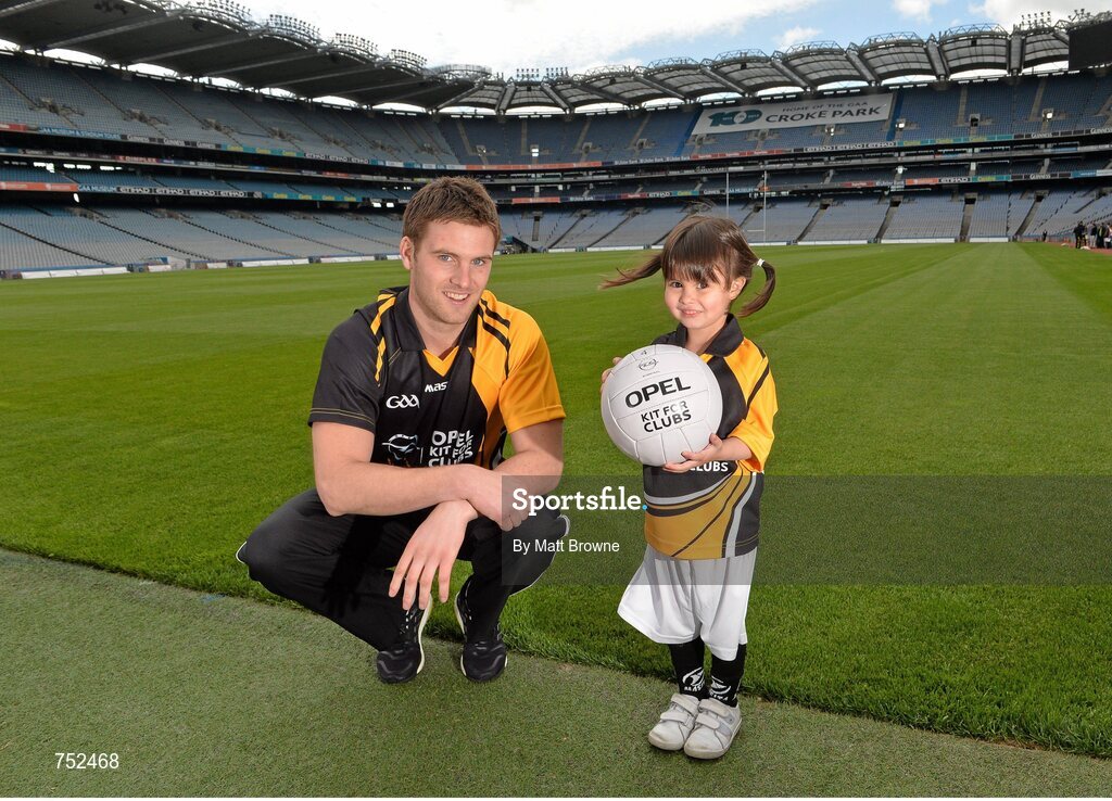 23 May 2013; Cork footballer Eoin Cadogan with four year old Carolina Gallagher, from Swords, Co. Dublin, pictured at the launch of Opel Kits for Clubs 2013 – For every test drive, car service or Opel purchase made through the Opel dealer network, your local GAA club is awarded points. Build up your points and redeem them against high quality kit for your club! Log onto opelkitforclubs.com and start earning points today. Support your local GAA club! Croke Park, Dublin. Picture credit: Matt Browne / SPORTSFILE