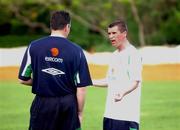 21 May 2002; Republic of Ireland captain Roy Keane in conversation with goalkeeping coach Packie Bonner during squad training. Adagym, Saipan. Soccer. Cup2002. Picture credit; David Maher / SPORTSFILE *EDI*