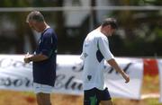 22 May 2002; Republic of Ireland captain Roy Keane walks past manager Mick McCarthy during squad training. Adagym, Saipan. Soccer. Cup2002. Picture credit; David Maher / SPORTSFILE *EDI*