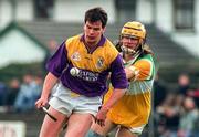 23 March 1997; Adrian Fenlon of Wexford in action against Ger Oakley of Offaly during the National Hurling League Division 1 match between Offaly and Wexford at St. Brendan's Park in Birr, Offaly. Photo by David Maher/Sportsfile