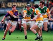 22 June 1997; Adrian Fenlon of Wexford, in action against Colm Cassidy, left, with, Martin Hanamy, and Kevin Martin of Offaly, right during the GAA Leinster Senior Hurling Championship Semi-Final match between Wexford and Offaly at Croke Park in Dublin. Photo by Ray McManus/Sportsfile